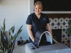 Spas in Michigan: A medical spa specialist smiles as she greats guests.