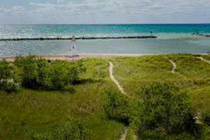 Coastal dunes and lighthouse view on Lake Michigan shoreline in Southwest Michigan